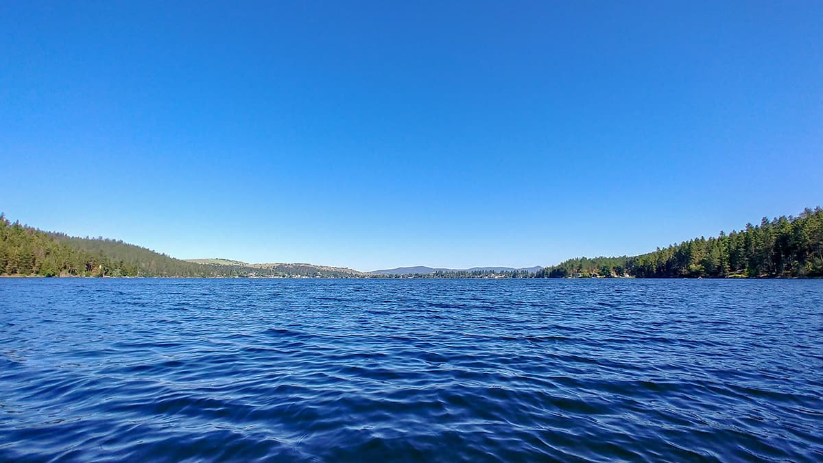 Out on Liberty Lake, with forested hills on both shores